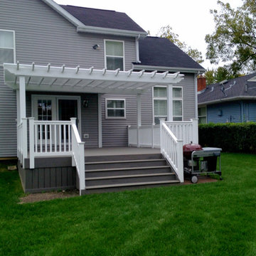 TimberTech Deck with White Vinyl Pergola - Archadeck of Chicagoland