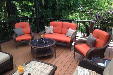 Example of a mid-sized classic backyard deck design in Portland with no cover