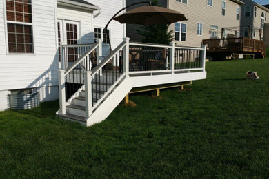 Mid-sized elegant deck photo in Other