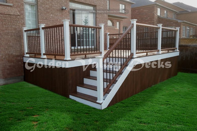 trex spice rum decking with white railing and white facia