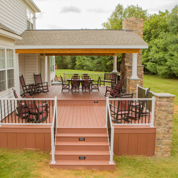 Two tier deck with stone fireplace