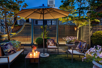 Traditional roof rooftop terrace in New York with feature lighting.