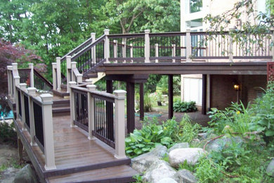 Deck - large traditional backyard deck idea in Detroit with no cover