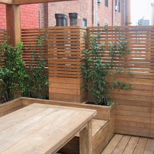 Deck container garden - large contemporary rooftop deck container garden idea in New York with no cover