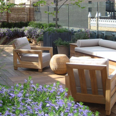 Example of a large trendy rooftop deck container garden design in New York with no cover