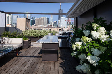 Inspiration for a modern rooftop deck remodel in Chicago with a fire pit