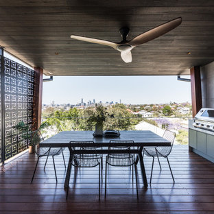 Photo of a contemporary deck in Brisbane with an outdoor kitchen.