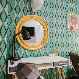 Photo of a medium sized bohemian study in Bilbao with multi-coloured walls, medium hardwood flooring, no fireplace and a built-in desk.