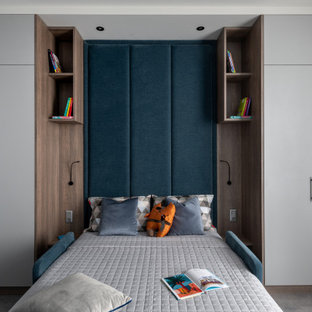 Idee per una grande cameretta per bambini contemporanea con pareti grigie, pavimento in laminato e pavimento grigio