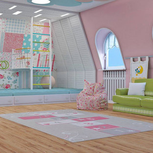 Idee per una grande cameretta per bambini da 4 a 10 anni minimal con pareti rosa, pavimento in laminato e pavimento multicolore