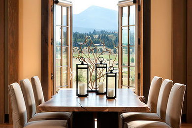 Example of a mountain style dining room design in Other