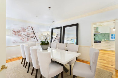 Photo of a medium sized nautical enclosed dining room in Other with multi-coloured walls, light hardwood flooring, no fireplace and beige floors.
