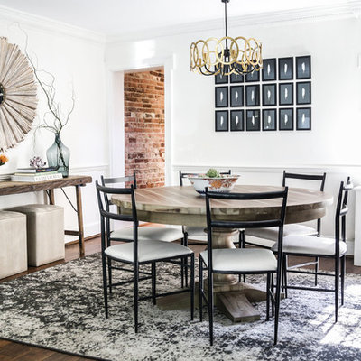 Example of a mid-sized transitional dark wood floor and brown floor enclosed dining room design in Austin with white walls and no fireplace