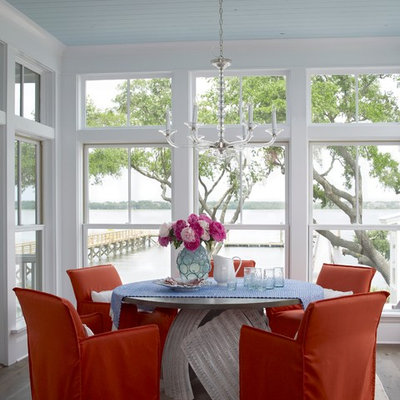 Kitchen/dining room combo - coastal medium tone wood floor kitchen/dining room combo idea in Charleston with white walls