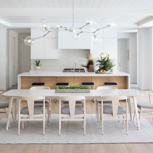 Trendy light wood floor and beige floor great room photo in Minneapolis with white walls