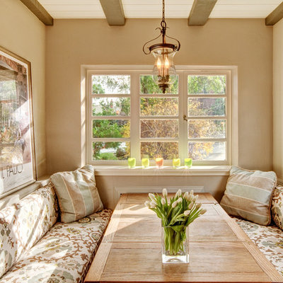 Dining room - mediterranean dining room idea in Seattle with beige walls