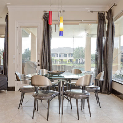 Dining room - contemporary dining room idea in Houston with white walls
