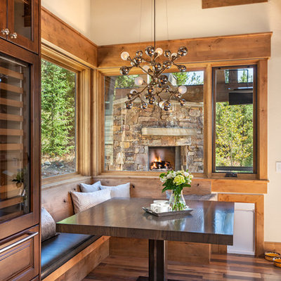 Dining room - rustic medium tone wood floor dining room idea in Denver with beige walls
