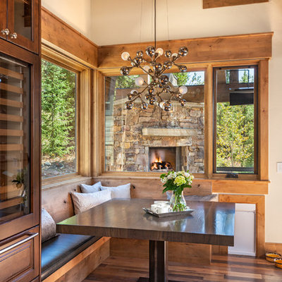Dining room - rustic medium tone wood floor dining room idea in Denver with beige walls and no fireplace