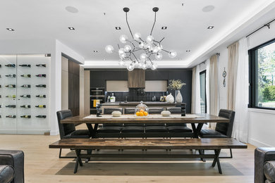 Transitional light wood floor and beige floor kitchen/dining room combo photo in Toronto