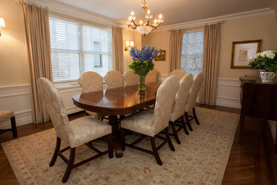 Large elegant dark wood floor kitchen/dining room combo photo in New York with beige walls