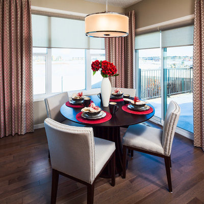 Inspiration for a contemporary dark wood floor dining room remodel in Calgary with beige walls