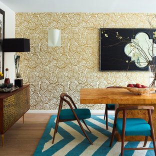 Design ideas for a contemporary dining room in New York with white walls and medium hardwood flooring.