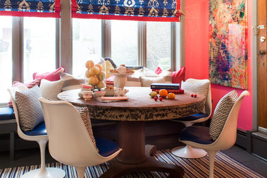 Enclosed dining room - mid-sized eclectic enclosed dining room idea in New York with multicolored walls
