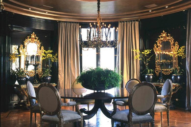 Photo of a large traditional enclosed dining room in San Francisco with black walls, medium hardwood flooring and brown floors.