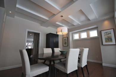 Mid-sized minimalist medium tone wood floor and brown floor enclosed dining room photo in Edmonton with white walls and no fireplace