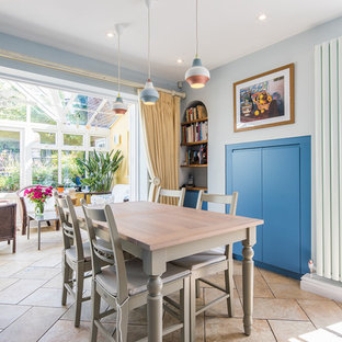 Design ideas for a medium sized classic kitchen/dining room in Other with ceramic flooring, beige floors and grey walls.