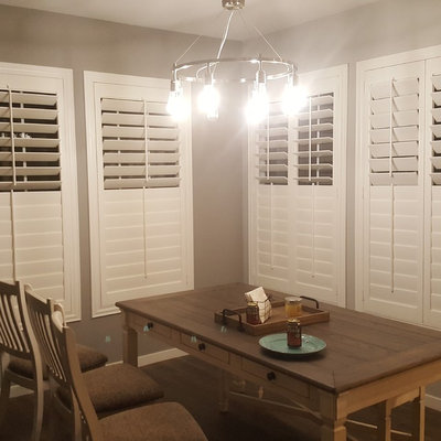 Mid-sized transitional dark wood floor and brown floor enclosed dining room photo in Phoenix with gray walls and no fireplace