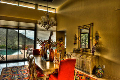 Example of a large transitional travertine floor and beige floor enclosed dining room design in Other with beige walls
