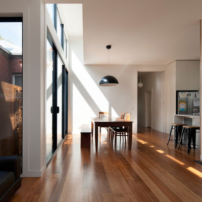 Trendy dining room photo in Melbourne with white walls