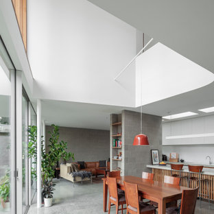 This is an example of a contemporary dining room in Melbourne.