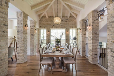 Dining room - traditional medium tone wood floor and brown floor dining room idea in Los Angeles with beige walls