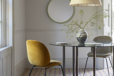 Photo of a contemporary dining room in Hampshire with carpet.