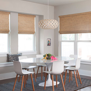 Ispirazione per una sala da pranzo chic con pareti beige, pavimento in legno massello medio e pavimento arancione