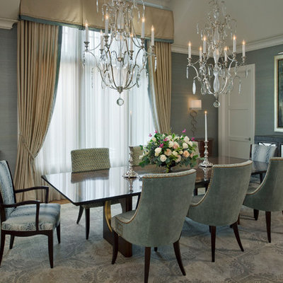 Example of a large transitional medium tone wood floor and brown floor enclosed dining room design in Baltimore with no fireplace and gray walls