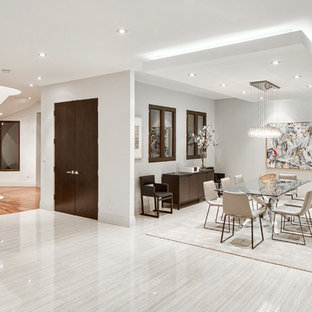 Ispirazione per una grande sala da pranzo minimal con pareti bianche e pavimento in gres porcellanato