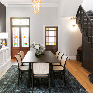 This is an example of a transitional dining room in Sydney.