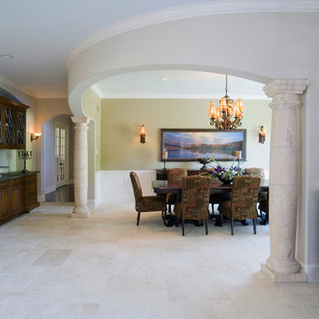 Arched dining room flanked by stone columns