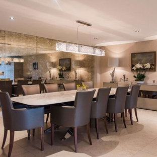 Design ideas for a contemporary dining room in Hertfordshire with beige walls and beige floors.