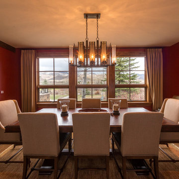 Red Elegant Dining Room with Warm Pendant Light Fixture