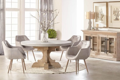 Inspiration for a country open plan dining room in Los Angeles with white walls, concrete flooring and grey floors.