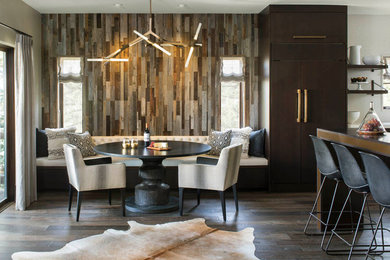 Inspiration for a large rustic dark wood floor and brown floor great room remodel in Denver with brown walls