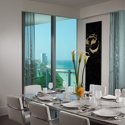 Example of a trendy dark wood floor dining room design in Miami