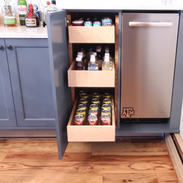 Bar Rollouts Next to Stainless Steel Ice Maker