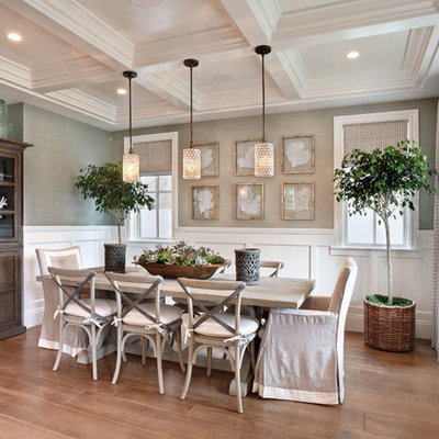 Inspiration for a coastal medium tone wood floor and beige floor dining room remodel in Orange County with gray walls