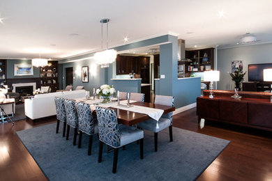 Inspiration for a mid-sized transitional dark wood floor great room remodel in Toronto with blue walls and no fireplace